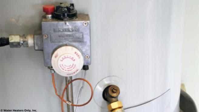 A temperature dial on an older water heater.